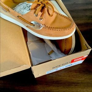 Tan Sperry coastfish shoes.